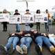 James Logan High School students hold signs honoring students killed at Marjory Stoneman Douglas High School as they stage a die in and observe a moment of silence during a walk out demonstration on March 14, 2018 in Union City, California.